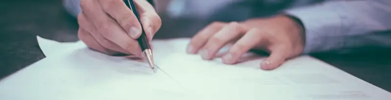 Signing the paperwork to sell a car in St. Louis