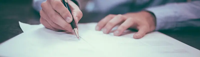 Signing the paperwork to sell a car in St. Louis