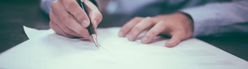 Signing the paperwork to sell a car in St. Louis
