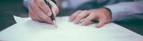Signing the paperwork to sell a car in St. Louis
