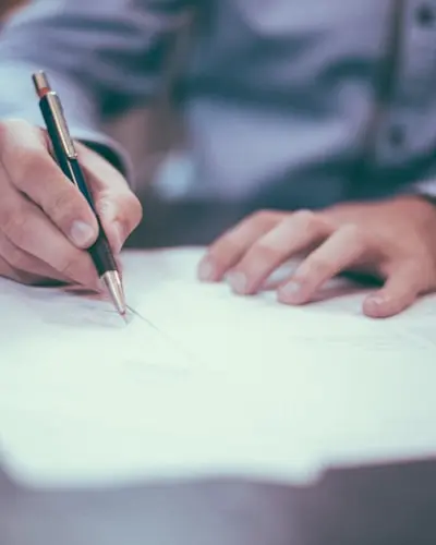 Signing the paperwork to sell a car in St. Louis